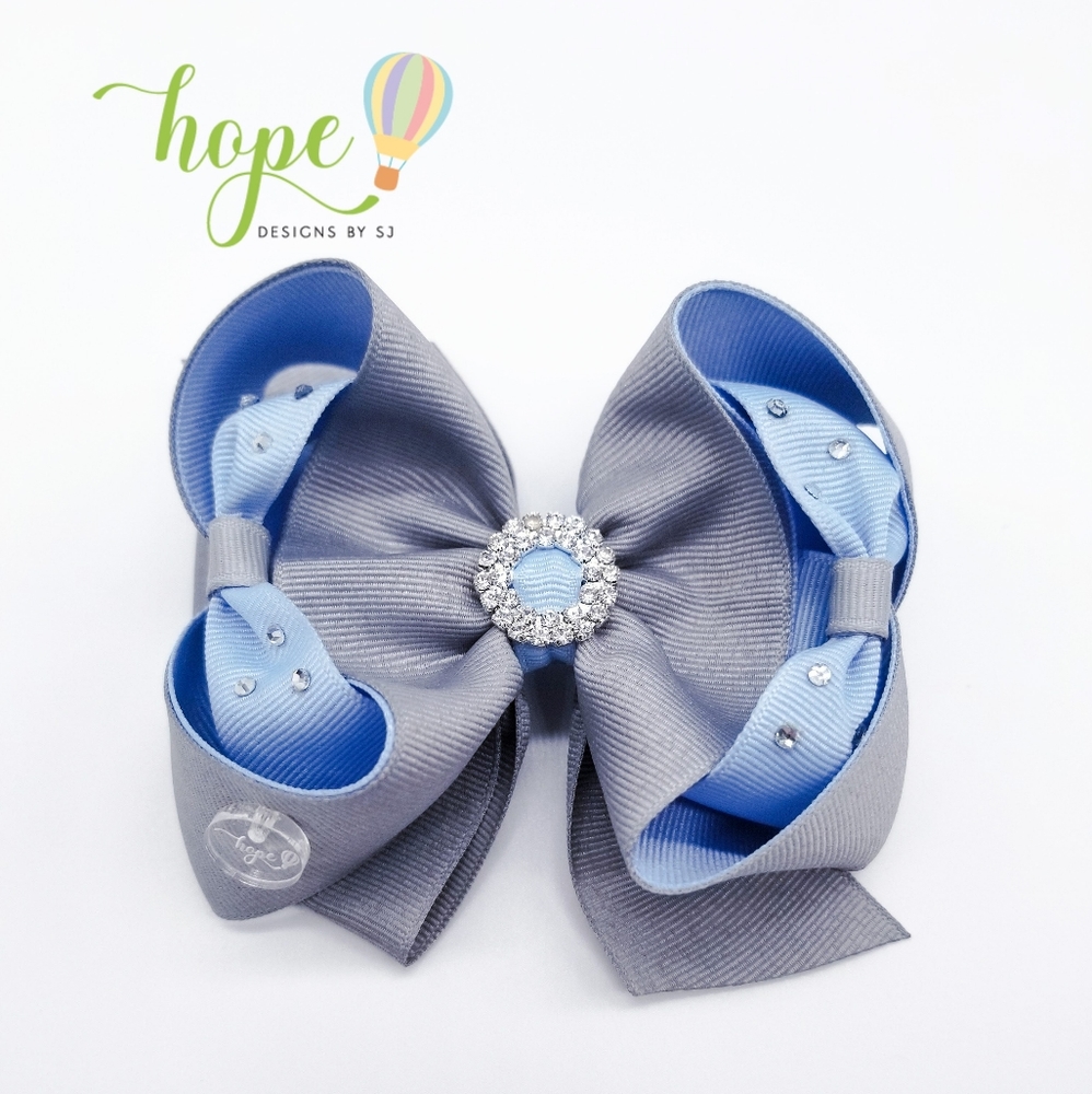 Handmade hair bow for girls with delicate details. I love it!